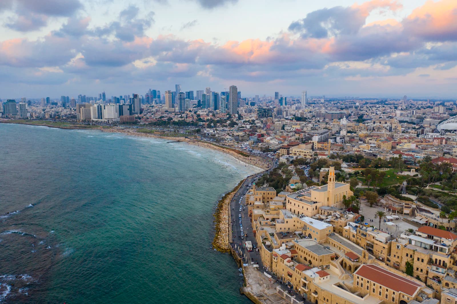Aerial view of a Mediterranean coastal city at sunset